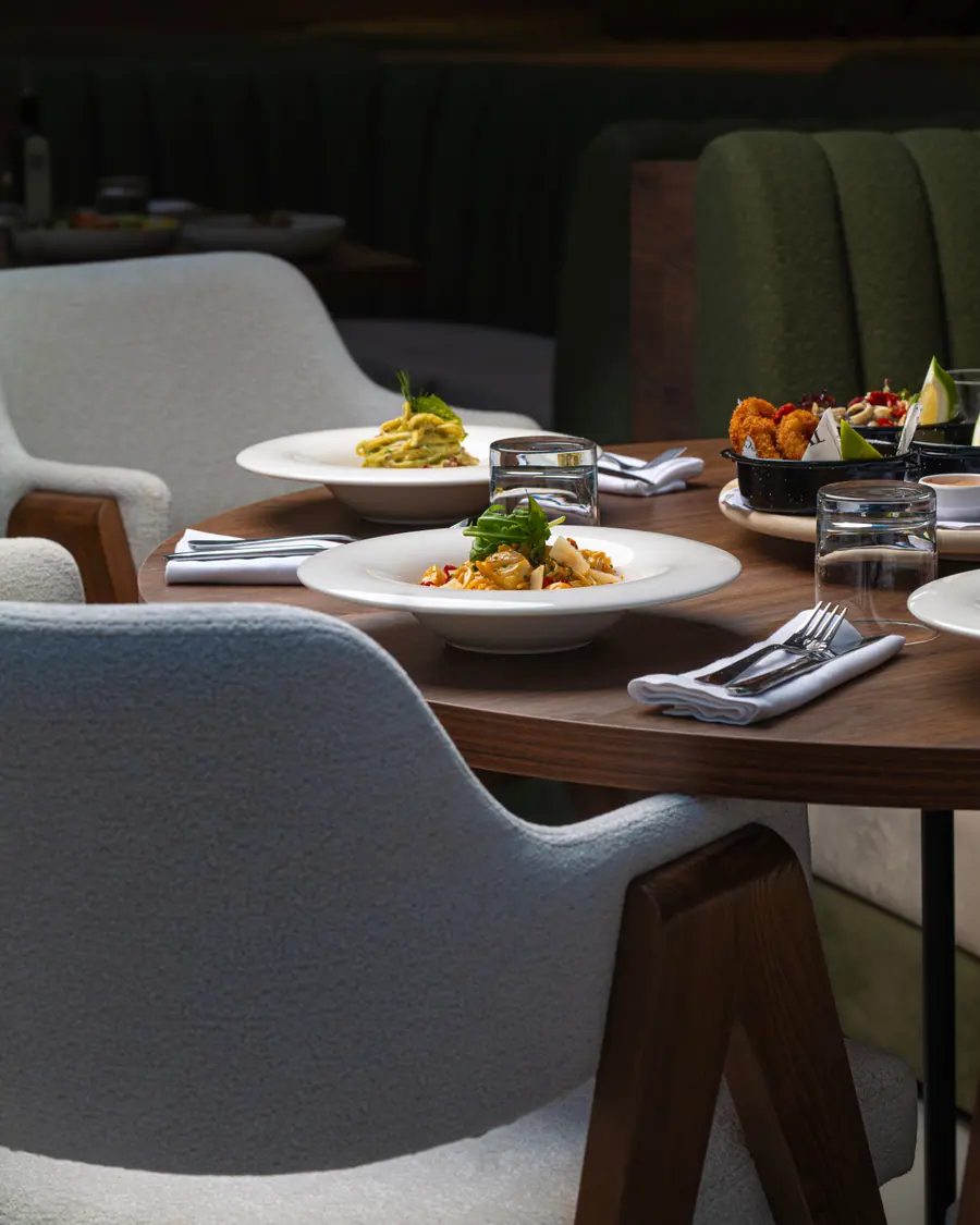 Restaurant table set with plated dishes