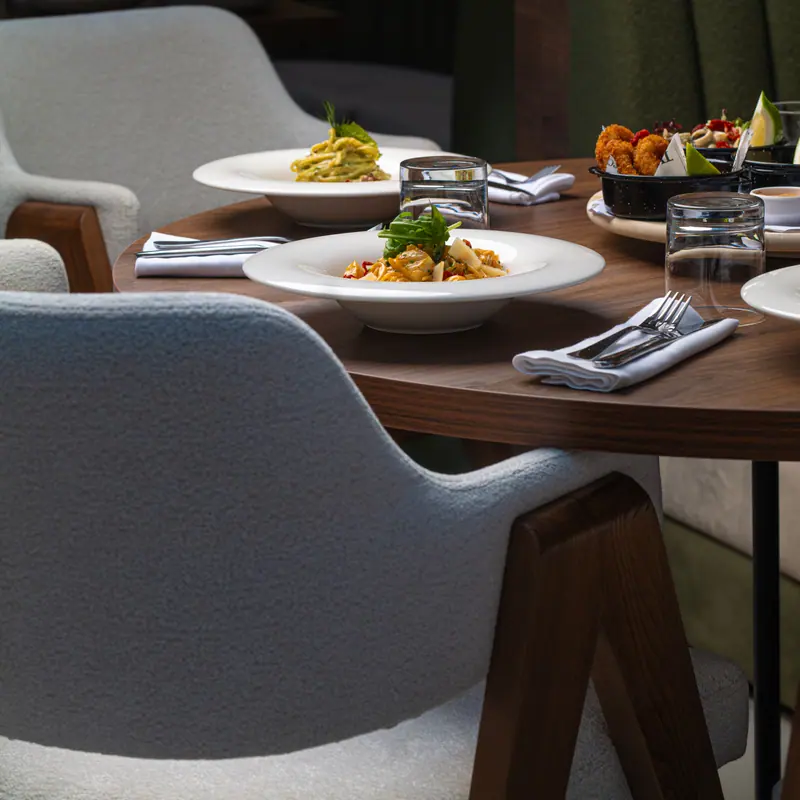 Restaurant table set with plated dishes